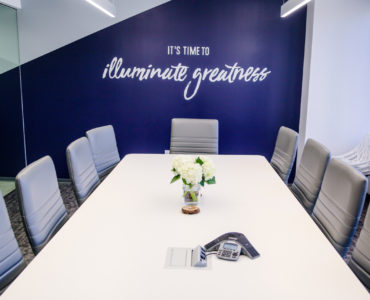 Conference room with illuminate greatness mural